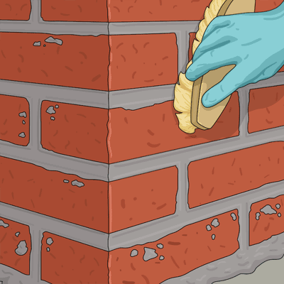 Borsta den murade ytan med en hård borste
